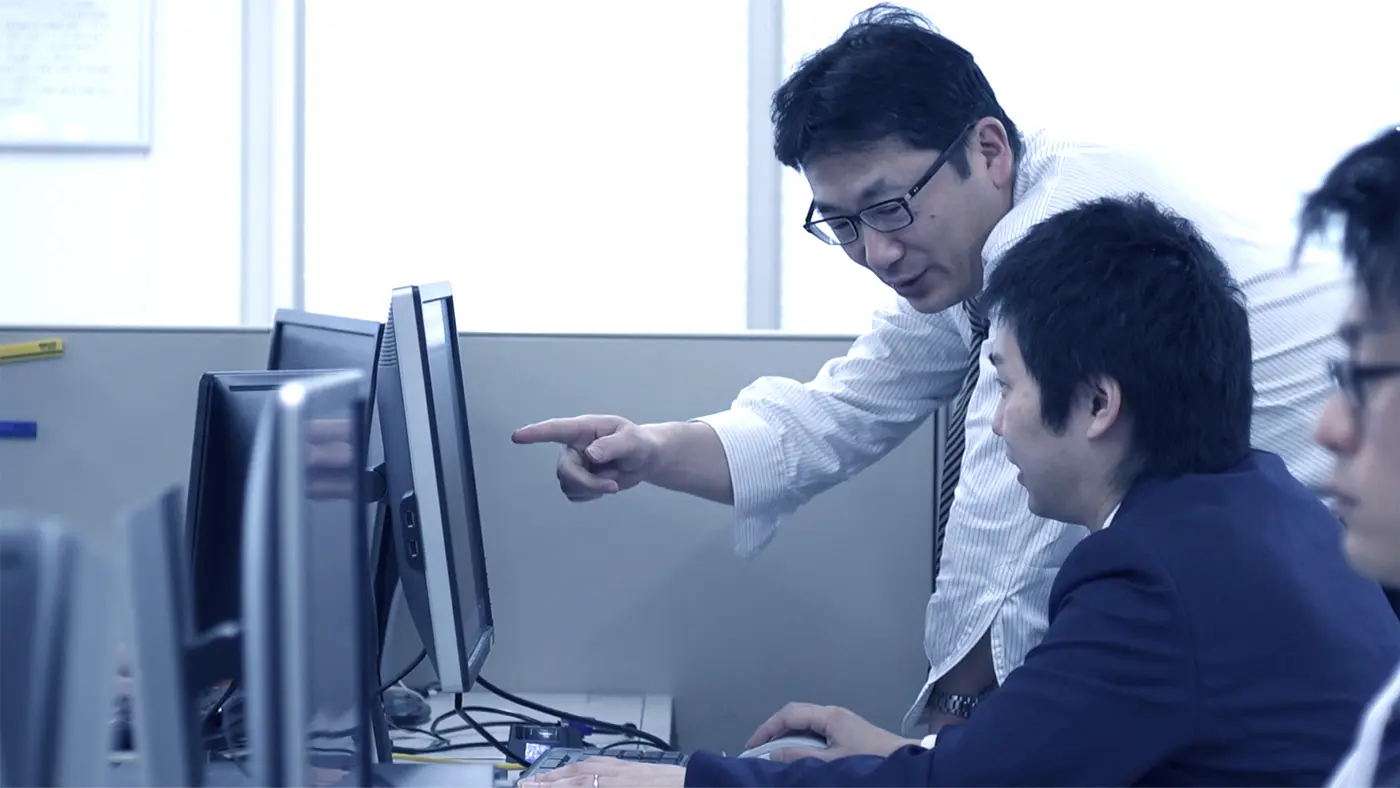 Yamaguchi-san and Tateishi-san during the early days of development